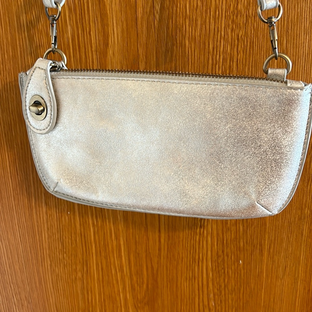 NWT silver purse with detachable strap and extra button to secure closure